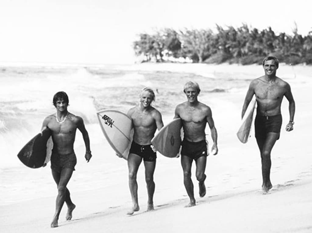 Men Walking on the Beach